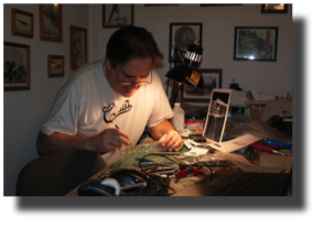 Model Maker.-Guillermo Rojas Bazán in his studio in Royal Oak MI, working on his model of Curtiss Goshawk.