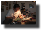 Model Maker.-Guillermo Rojas Bazán in his studio in Royal Oak MI, working on his model of Curtiss Goshawk.